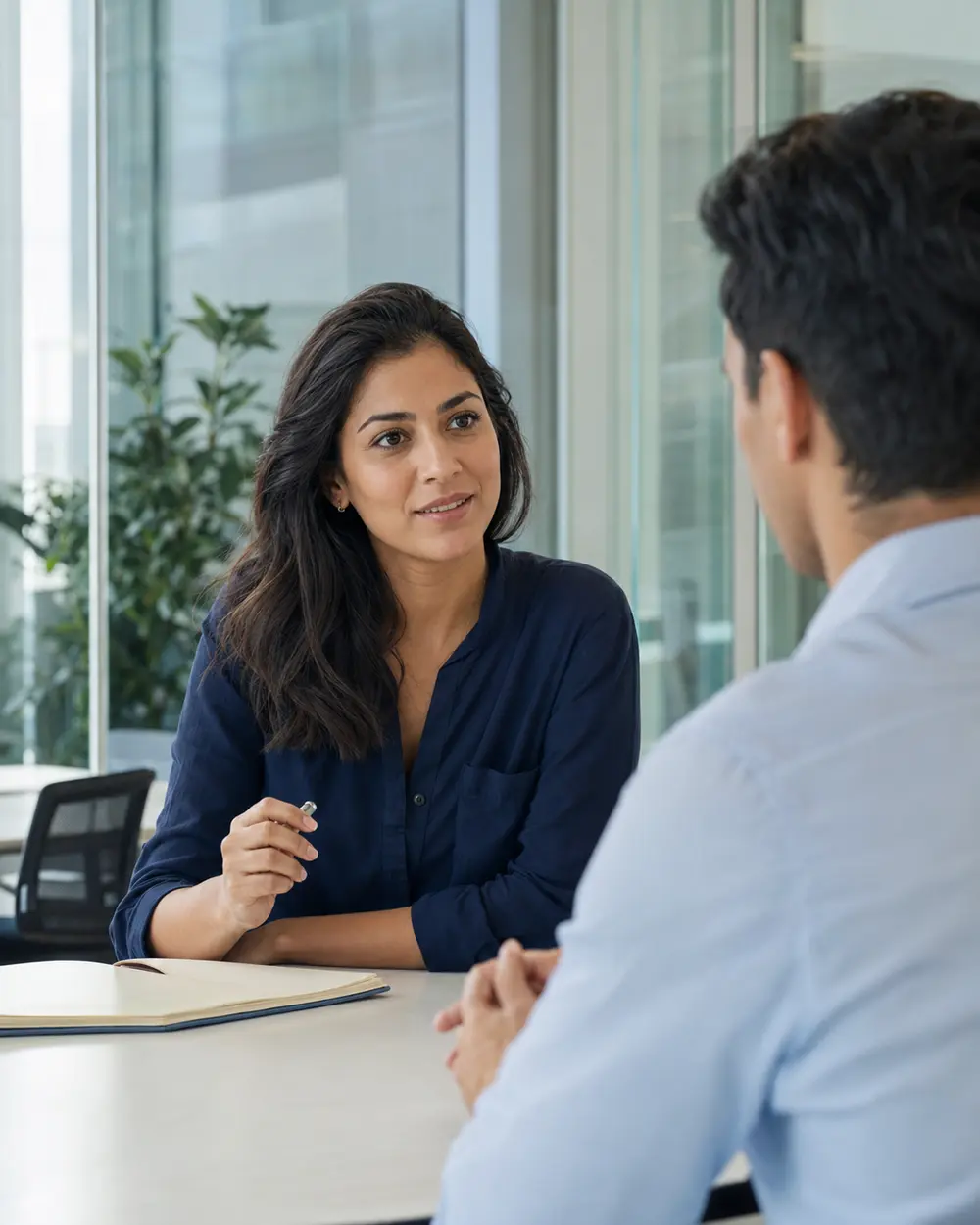 A recruiter guiding a candidate in a one-to-one conversation