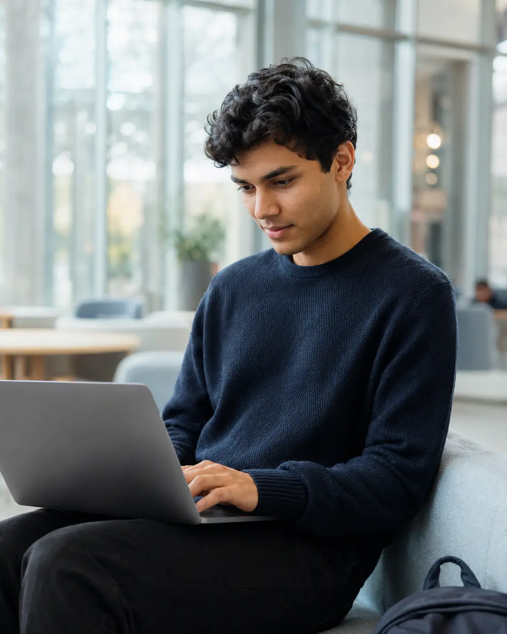 A university student building skills on a laptop
